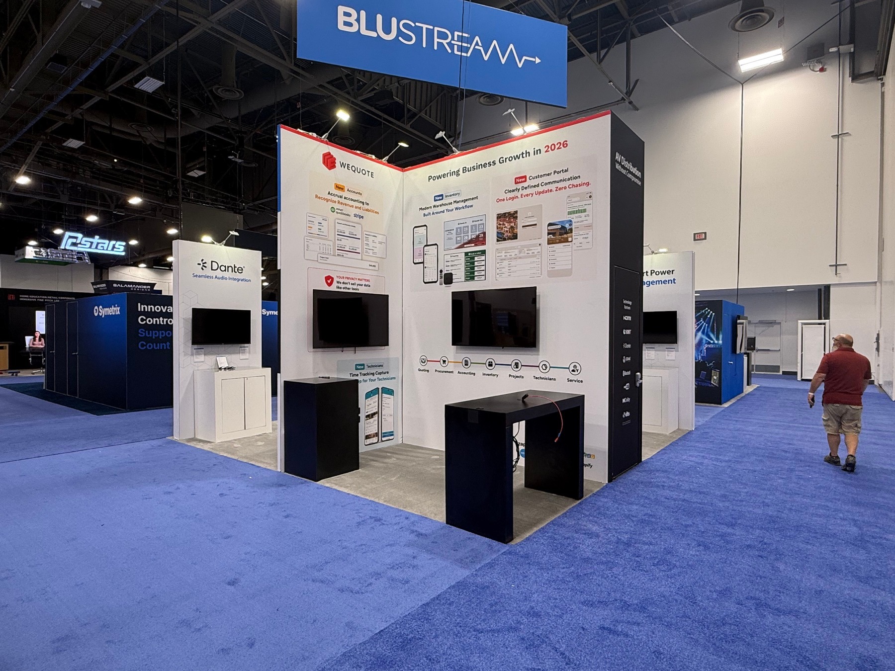 Finished exhibition booth with large printed graphic wall panels